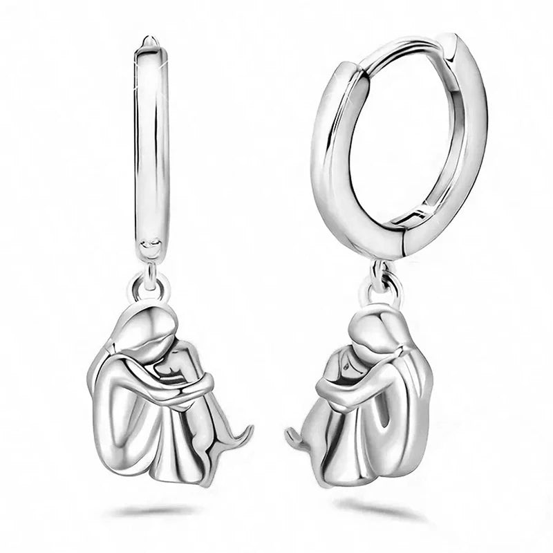 Örhängen - flicka som kramar hund