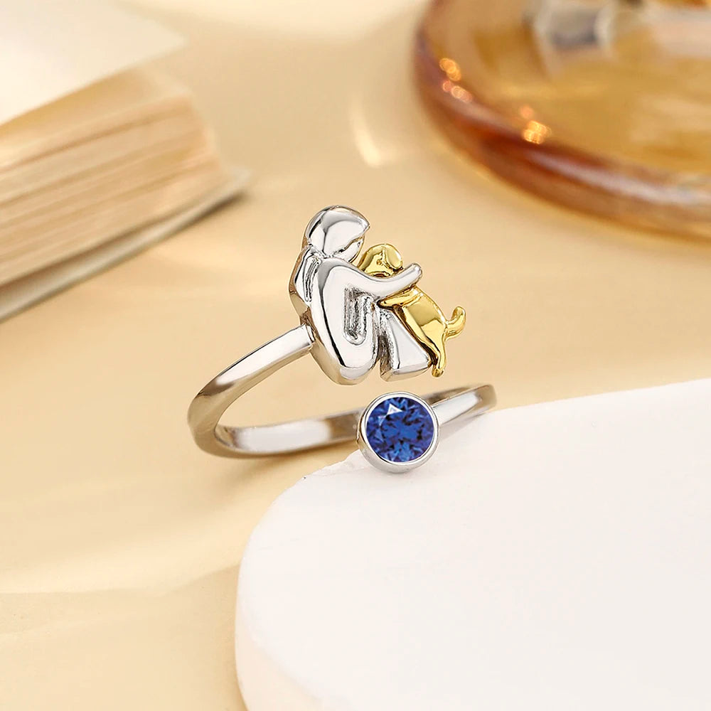 Ring med sten - Flicka som kramar hund