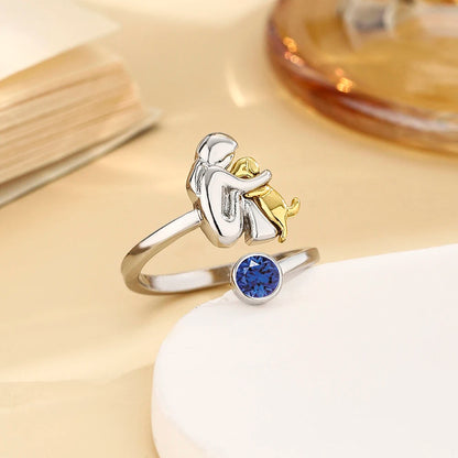 Ring med sten - Flicka som kramar hund